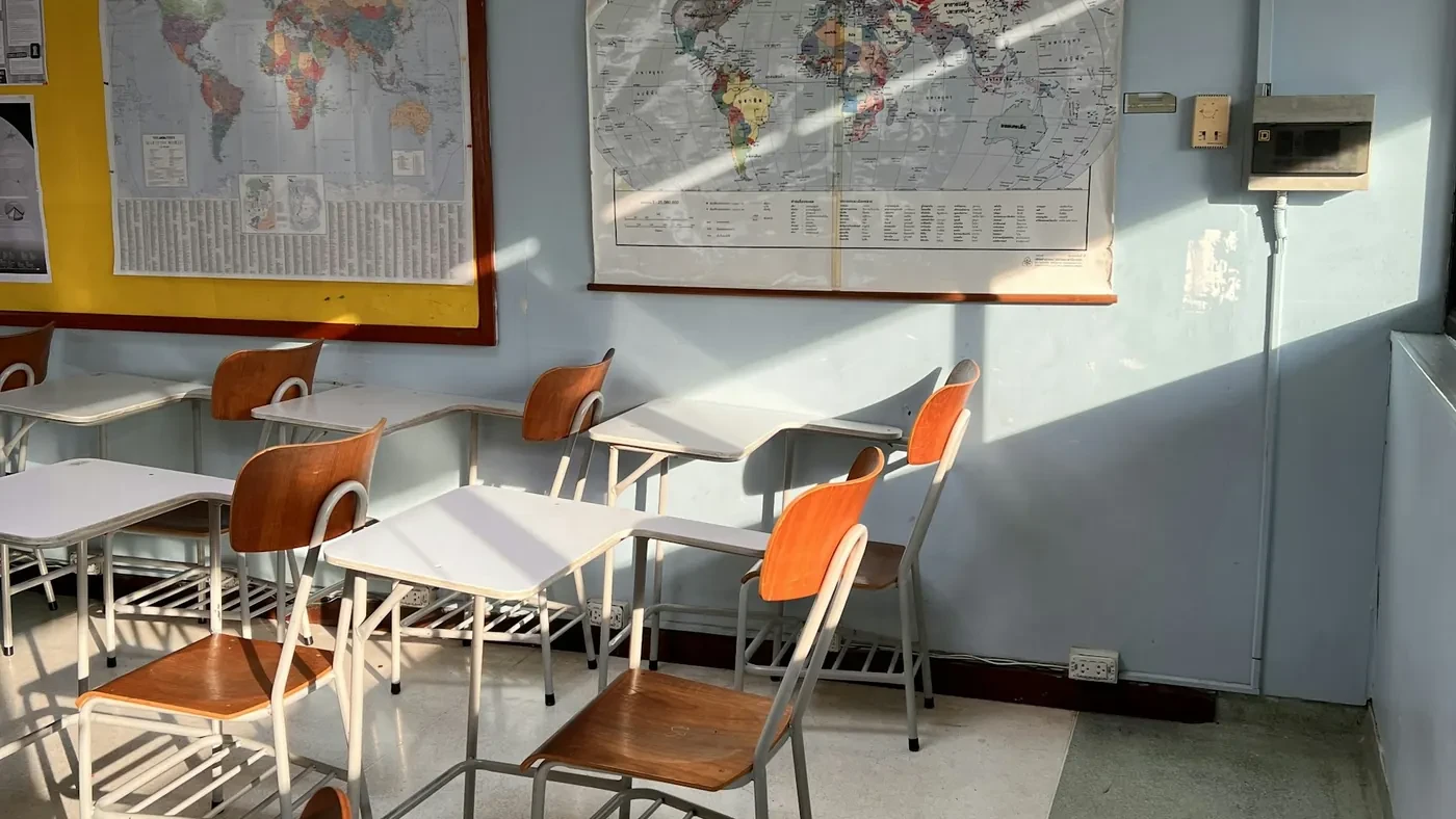Empty classroom with orange chairs