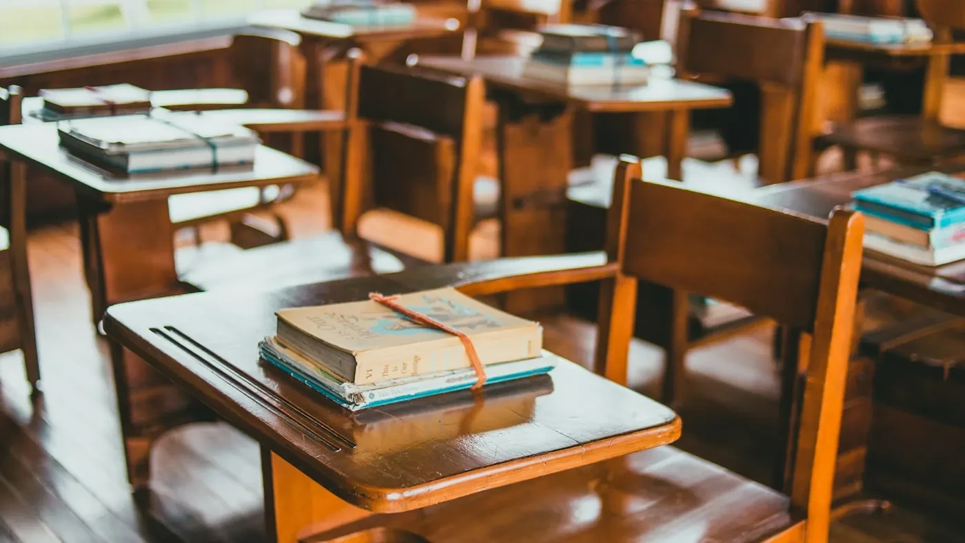 Classroom desks set with books